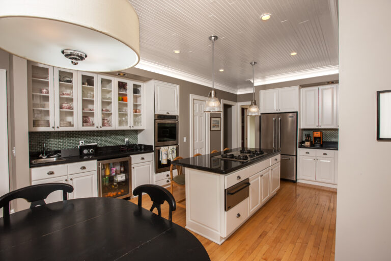 Freshly painted white beadboard ceiling and white cabinetry in a modern kitchen setting. Painted walls and ceiling in Macalister Groveland, St. Paul MN.