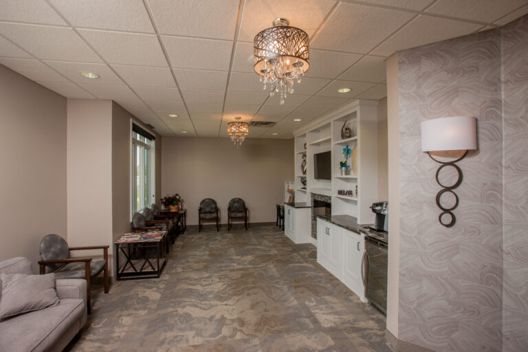 Freshly painted beige walls and white cabinetry in a modern office waiting room. located in Vadnais Heights Minnesota.