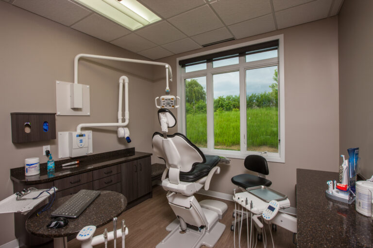 Finished taupe paint on smooth interior walls in a modern dental office exam room. Located In Vadnais Heights Minnesota